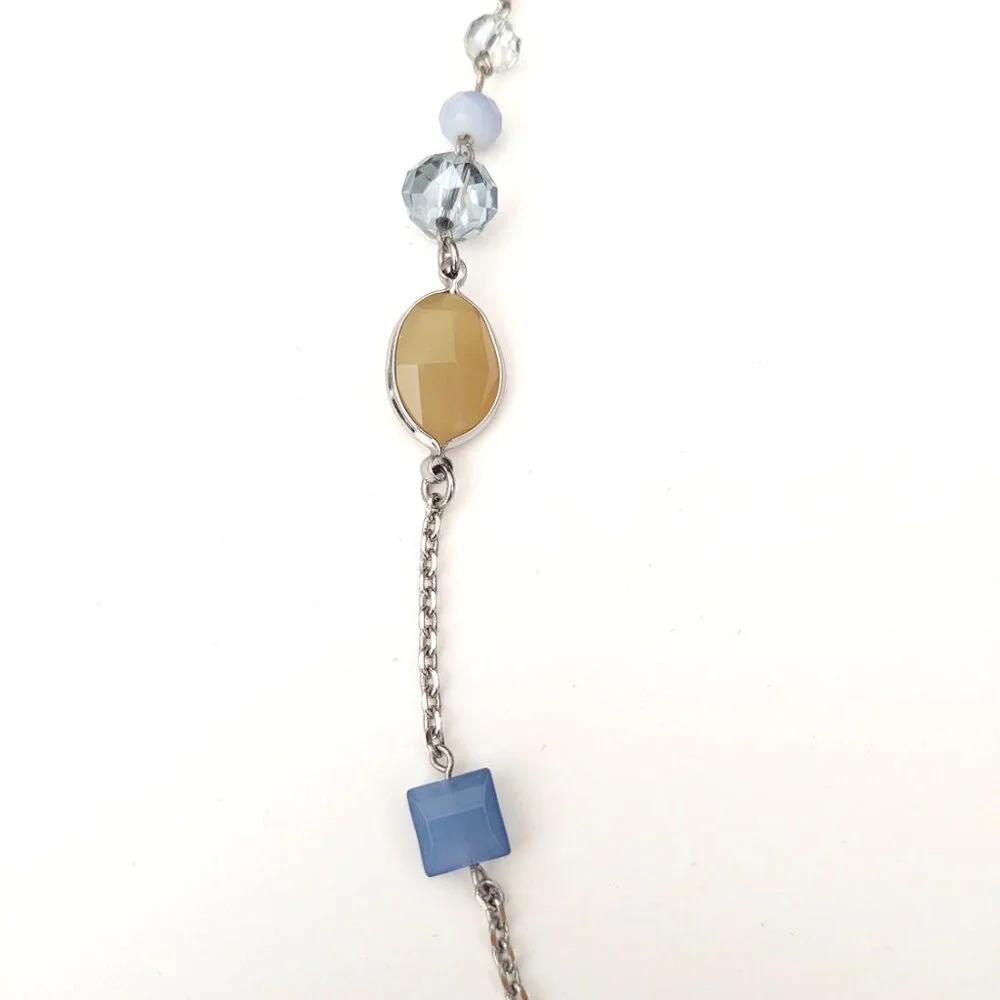Long silver necklace with blue and yellow glass beads